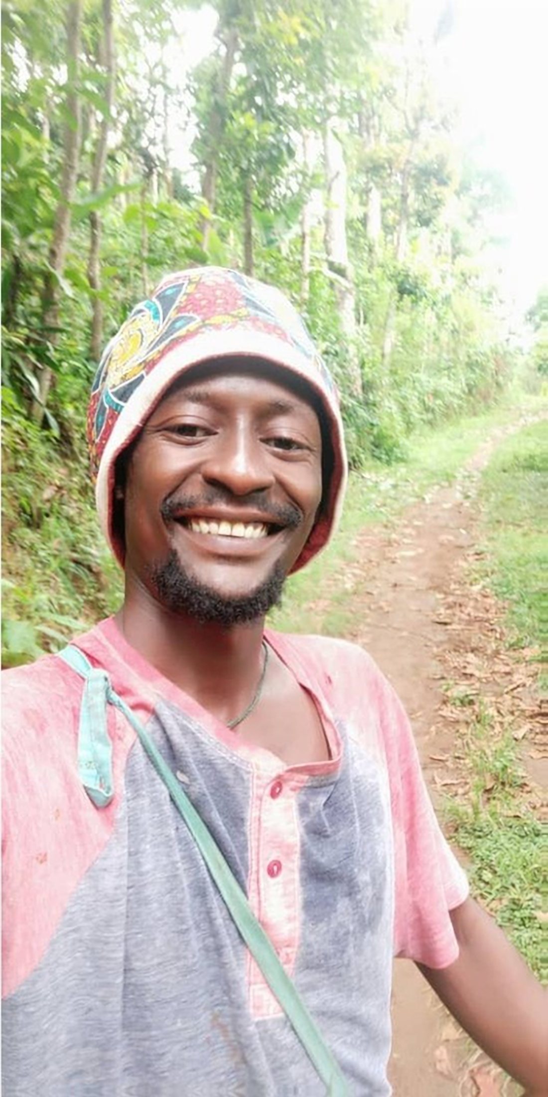 Wilfred Seraphine on a forest path near his home in Uru East